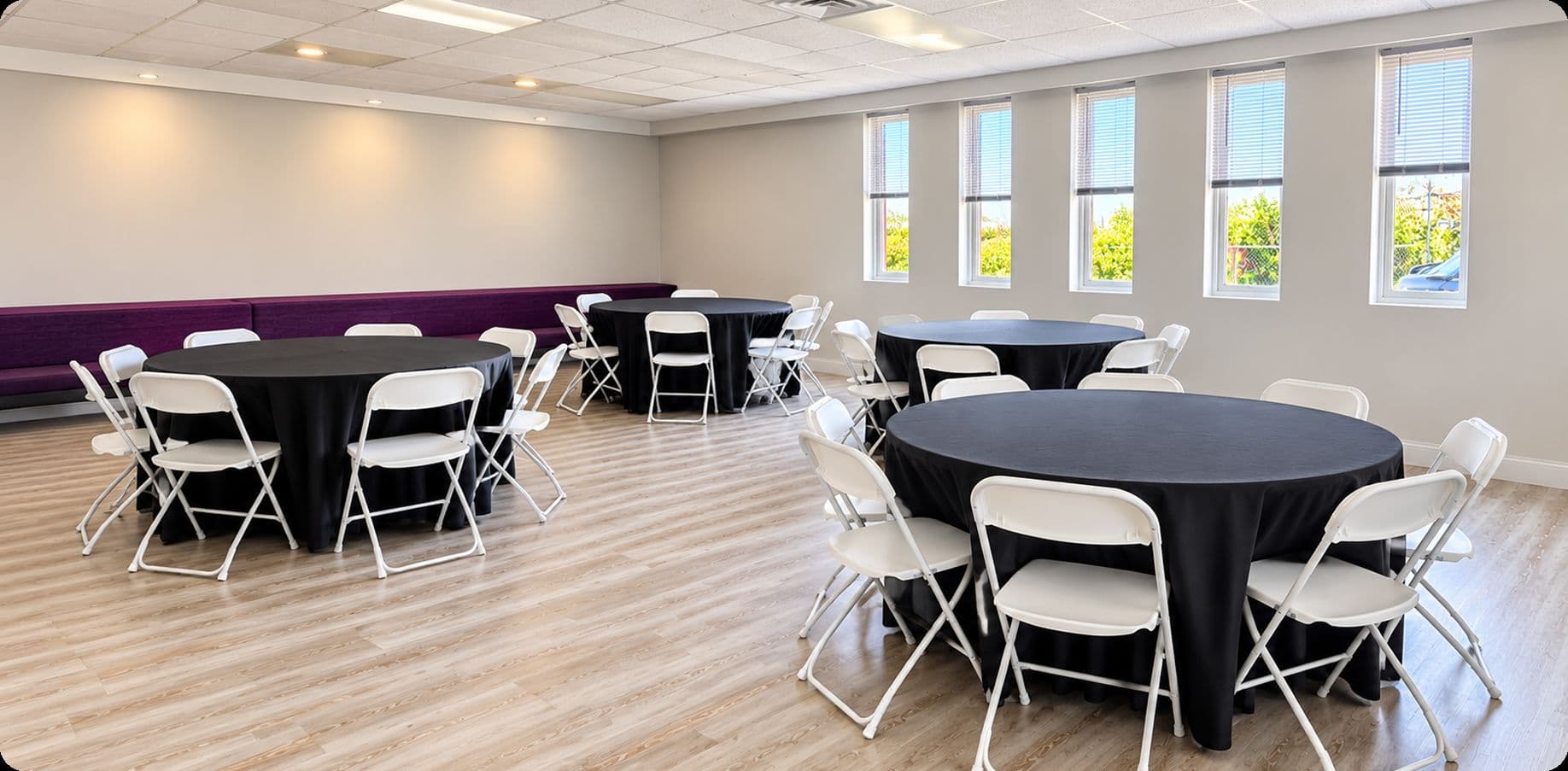 Buffalo Event Space room set with round tables and white chairs in Cheektowaga, NY